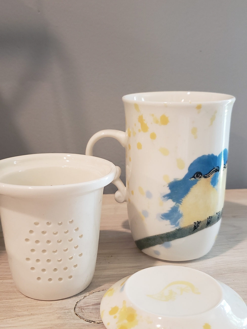Whimsical White Ceramic Tea Infuser with Blue & Yellow Bird Motif - Picture 3 of 5